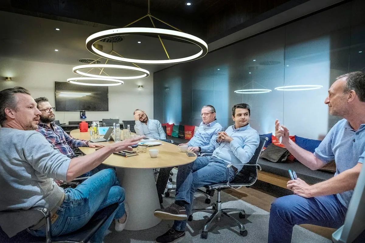 Team of consultants working on AI implementation in a boardroom
