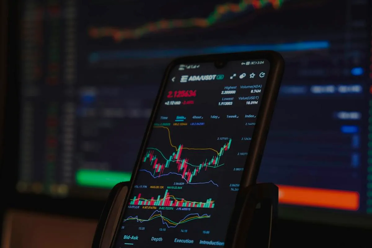 Trader watching bond market screens in a dim financial office