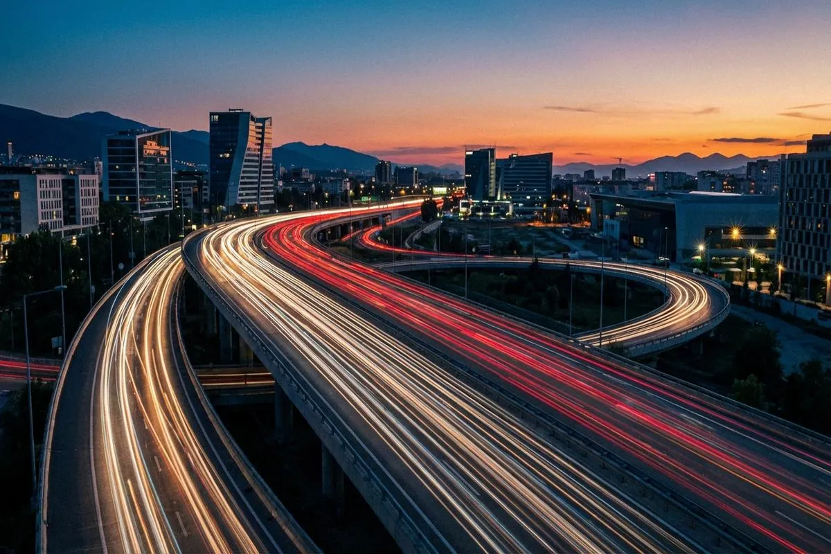 Blurred car taillights moving on a highway at twilight representing economic flow.