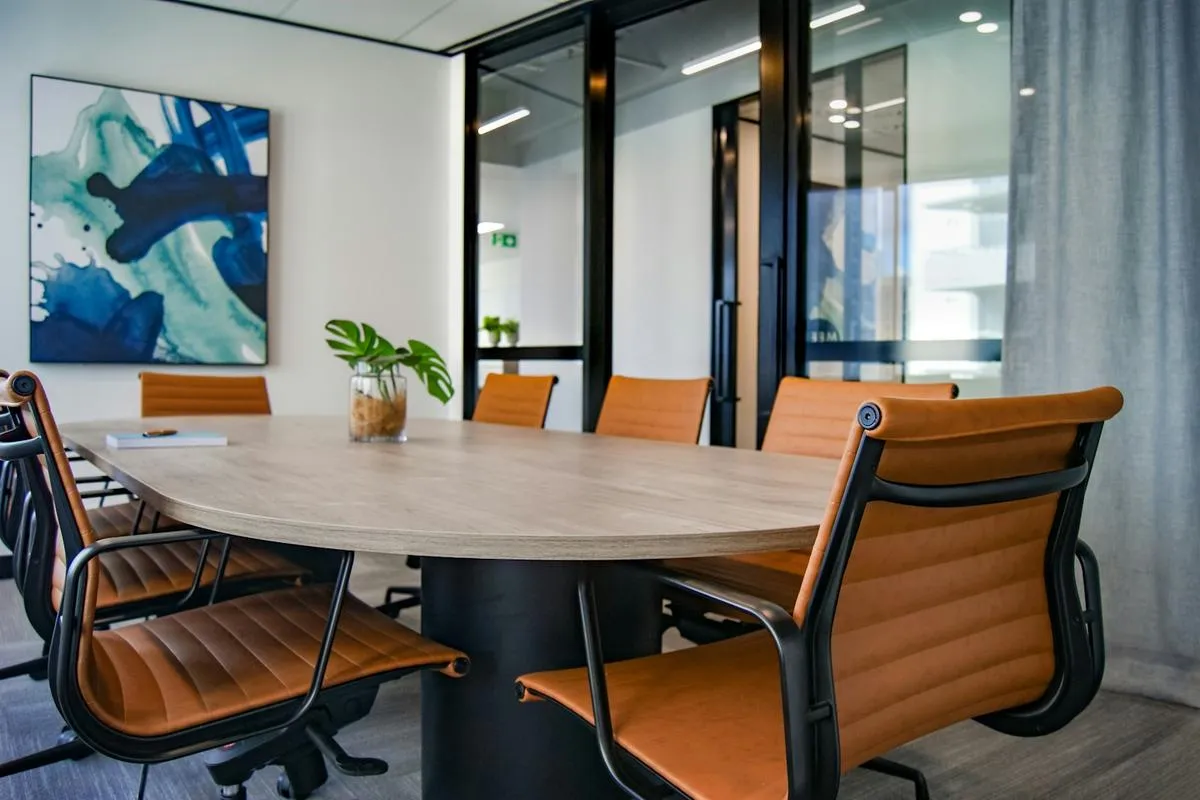 Business executives in a boardroom reviewing documents
